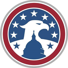 Circular emblem with a white eagle over a blue Capitol dome, surrounded by white stars inside a red ring with a gray outer border.
